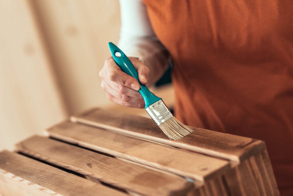 Refinish wooden crates for home storage